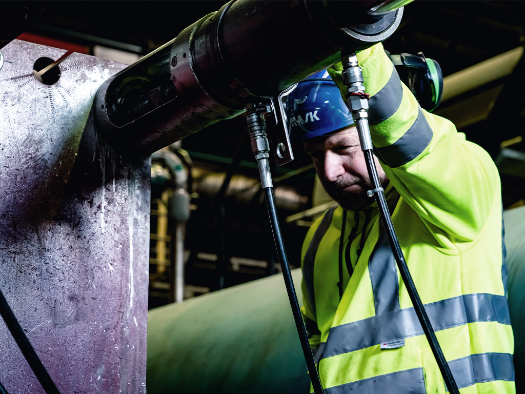 Service technican auditing pipes